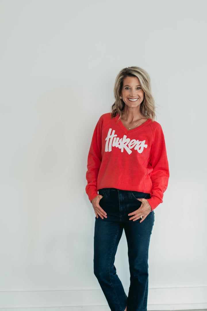 WHITE SPARKLE HUSKERS -  WOMEN'S FLEECE V-NECK - PARADISE RED