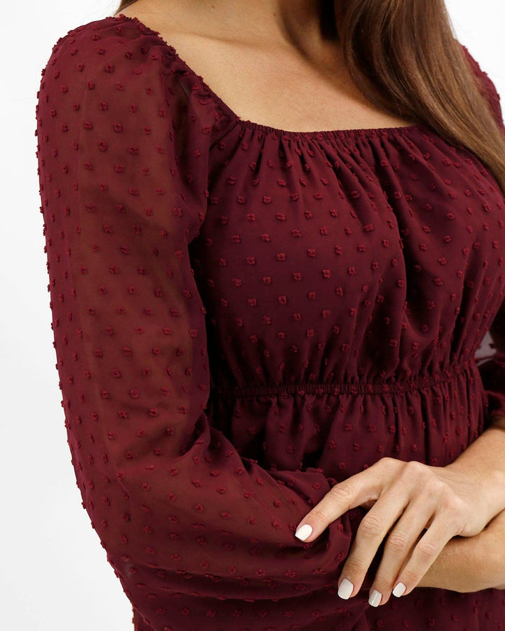 Dobby Dot Peplum Top In Zinfandel