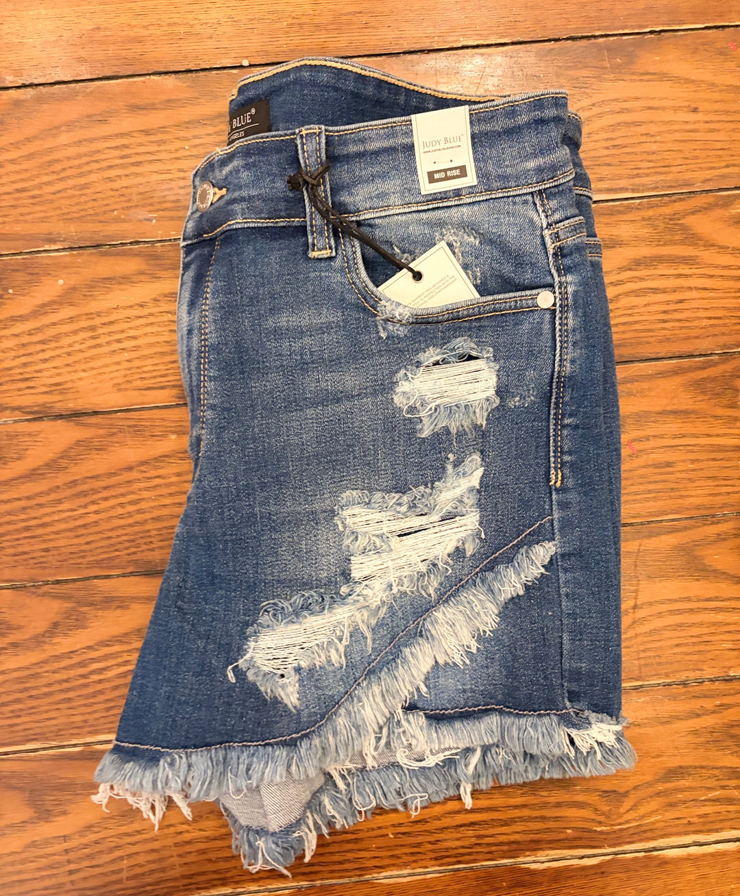 Judy Blue- Mid-Rise Tulip Hem Distressed Shorts